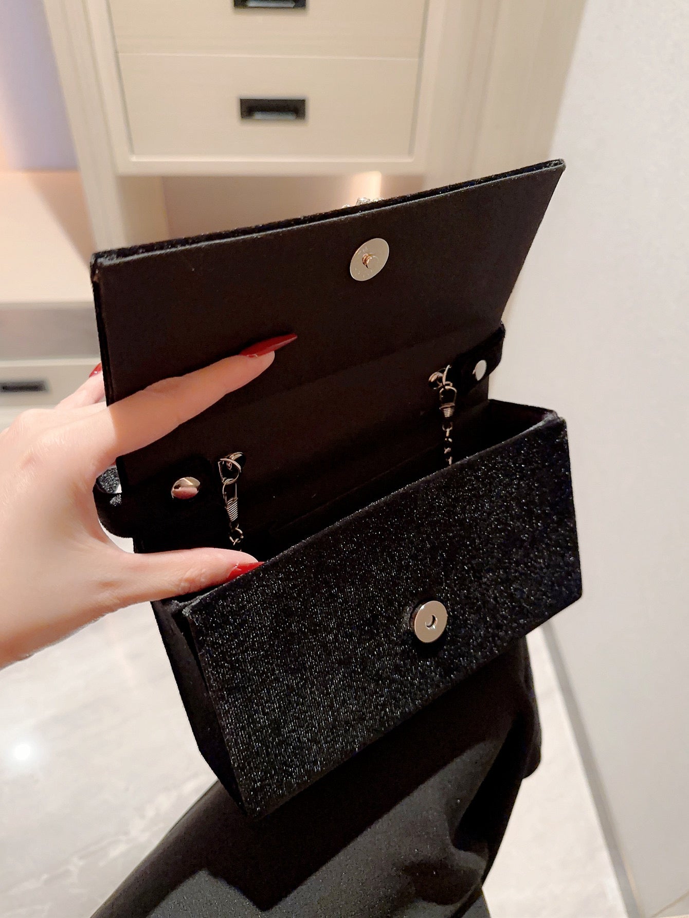 Women’s crystal elegant square buckle handbag in black.